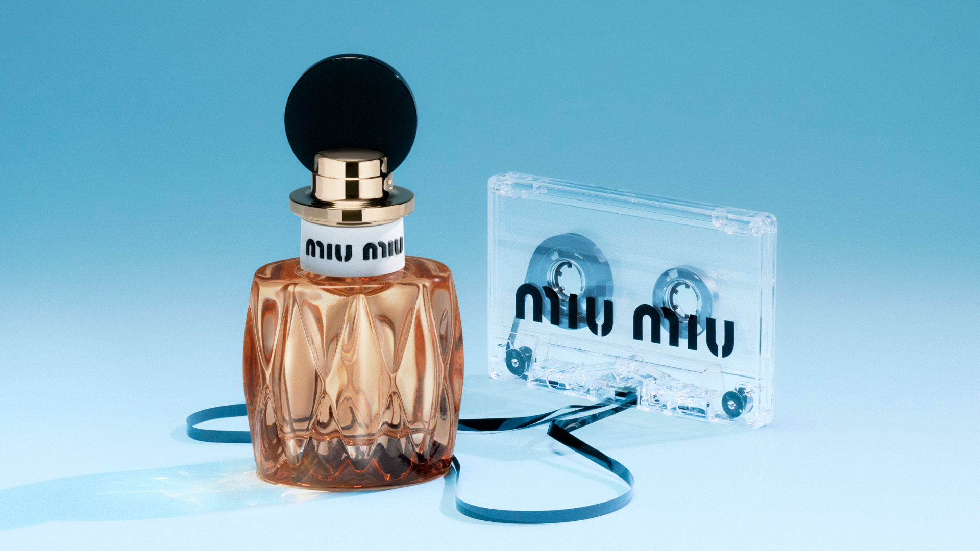 Miu Miu perfume bottle with strawberries, vanilla, white flowers, and sugar cubes